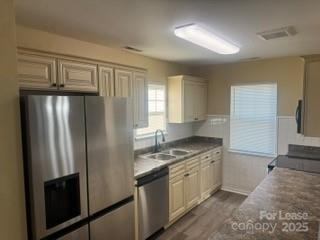 939 Matthews School Road Matthews, NC 28105 - Photo 4 of 21 a kitchen with stainless steel appliances granite countertop a refrigerator and a stove