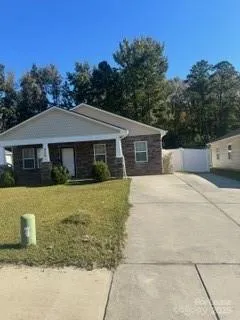 a house with trees in the background