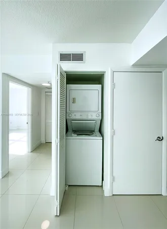 a view of a hallway with a kitchen