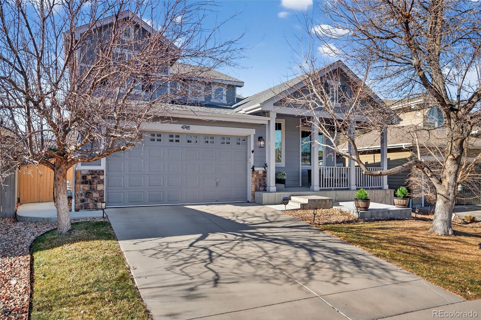 4748 Bluegate Drive Highlands Ranch, CO 80130 - Photo 4 of 49 a building with trees in front of it