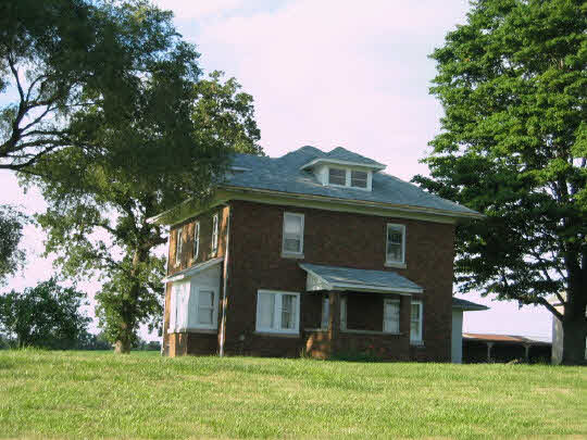 13473 Fritz Road Durand, IL 61024 - Photo 1 of 11 a front view of a house with garden