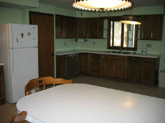 13473 Fritz Road Durand, IL 61024 - Photo 2 of 11 a kitchen with a refrigerator and a sink