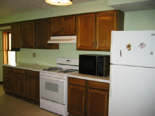 13473 Fritz Road Durand, IL 61024 - Photo 3 of 11 a kitchen with a stove and a refrigerator