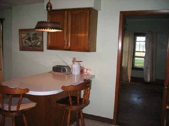 13473 Fritz Road Durand, IL 61024 - Photo 4 of 11 a room with a table and chairs
