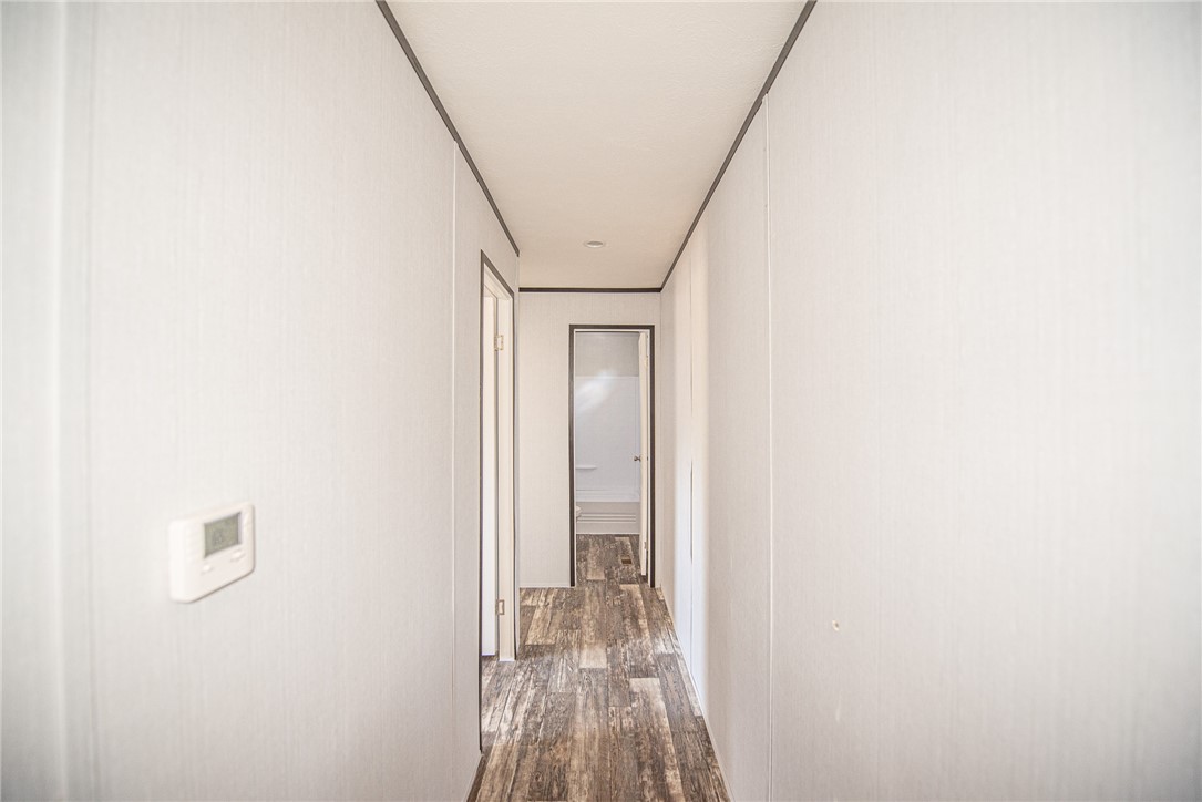 551 Boysenberry Road Somerville, TX 77879 - Photo 16 of 38 a view of hallway with wooden floor