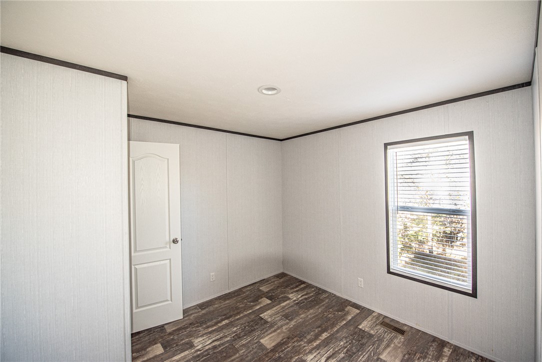 551 Boysenberry Road Somerville, TX 77879 - Photo 18 of 38 a view of an empty room with closet and a window