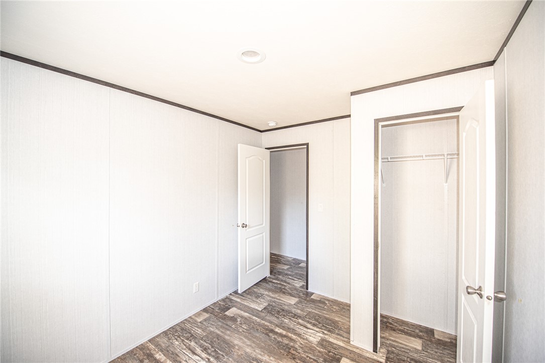 551 Boysenberry Road Somerville, TX 77879 - Photo 21 of 38 a view of a room with wooden floor