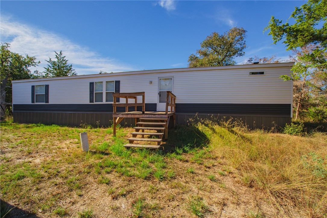551 Boysenberry Road Somerville, TX 77879 - Photo 28 of 38 a view of a swimming pool with potted plants and large tree
