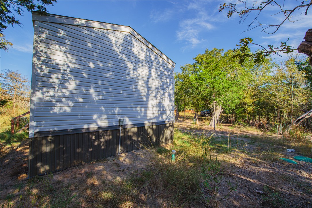 551 Boysenberry Road Somerville, TX 77879 - Photo 29 of 38 a backyard of a building