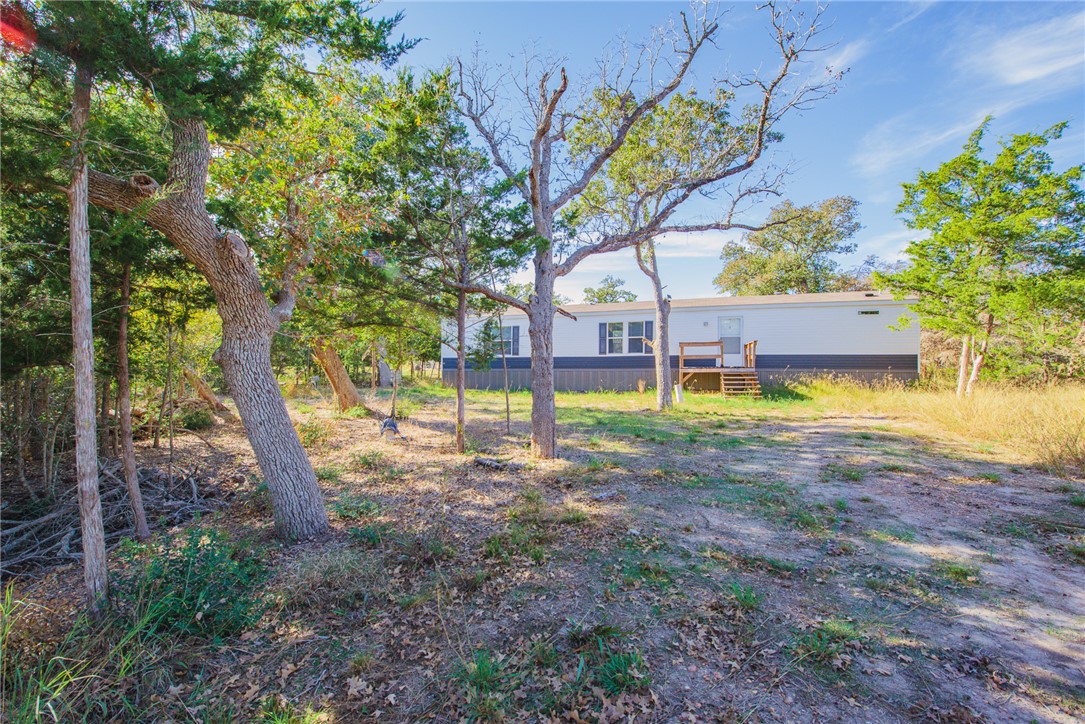 551 Boysenberry Road Somerville, TX 77879 - Photo 33 of 38 a view of a backyard with a garden