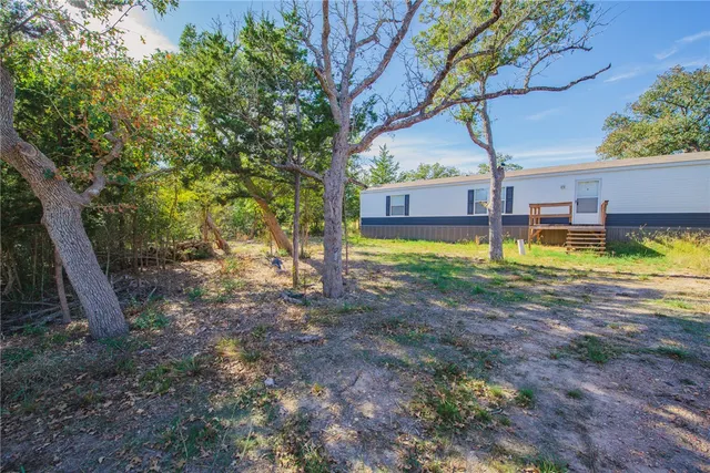 a view of a house with swimming pool