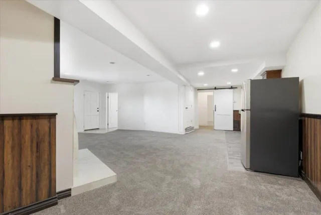 a view of a room with wooden floor