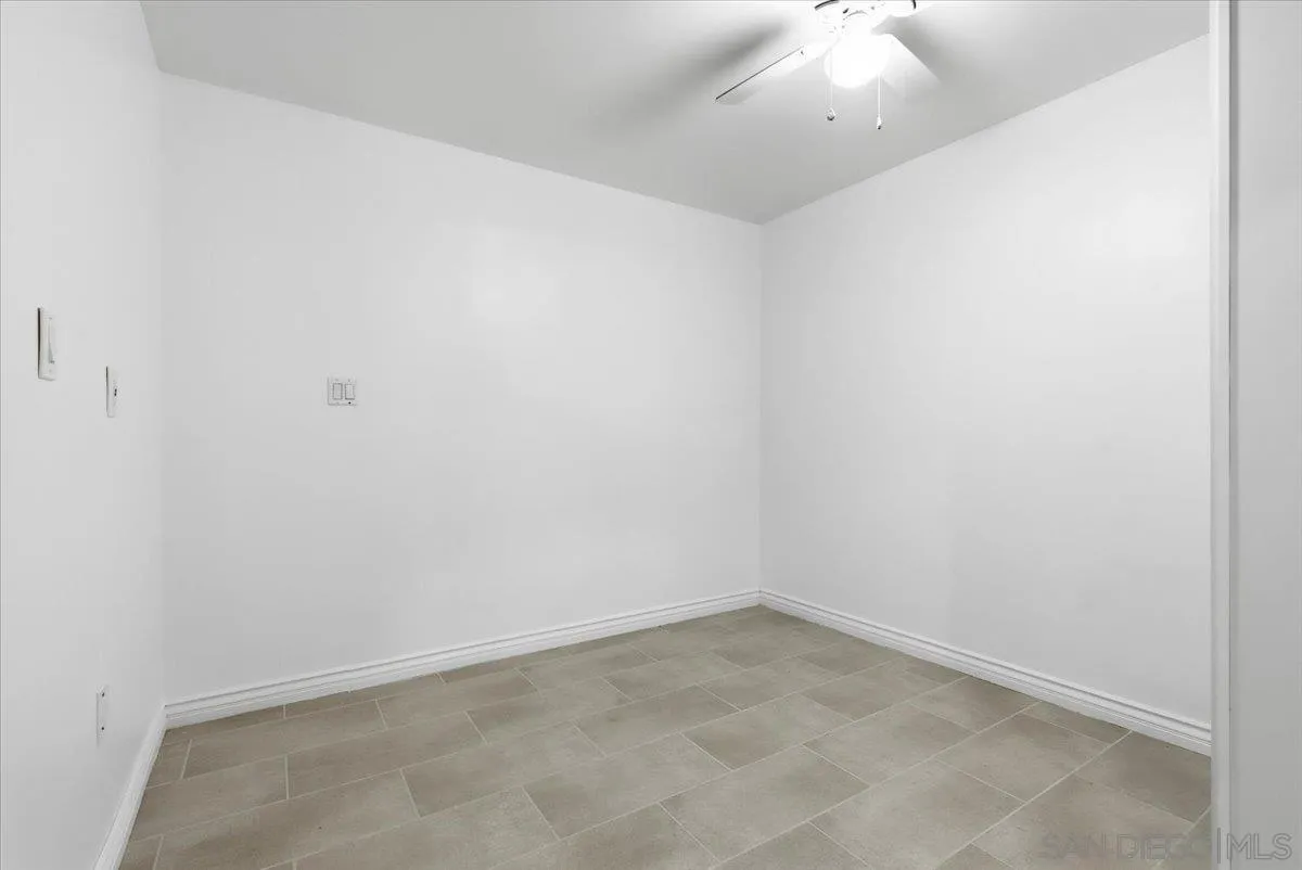 4341 Vista Way, Unit A La Mesa, CA 91941 - Photo 15 of 24 an empty room with a ceiling fan and entryway
