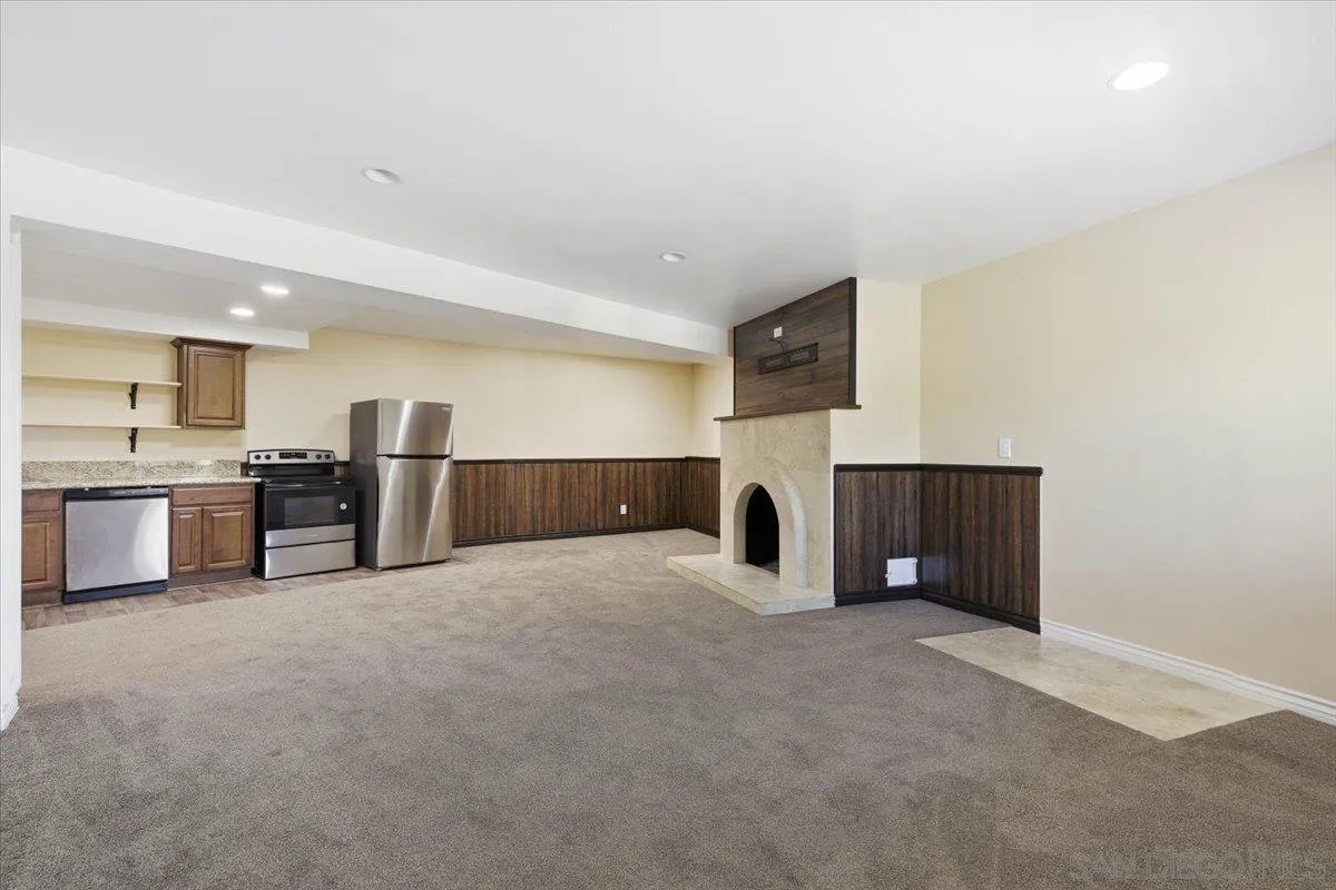 4341 Vista Way, Unit A La Mesa, CA 91941 - Photo 3 of 24 a large room with kitchen view and a fireplace