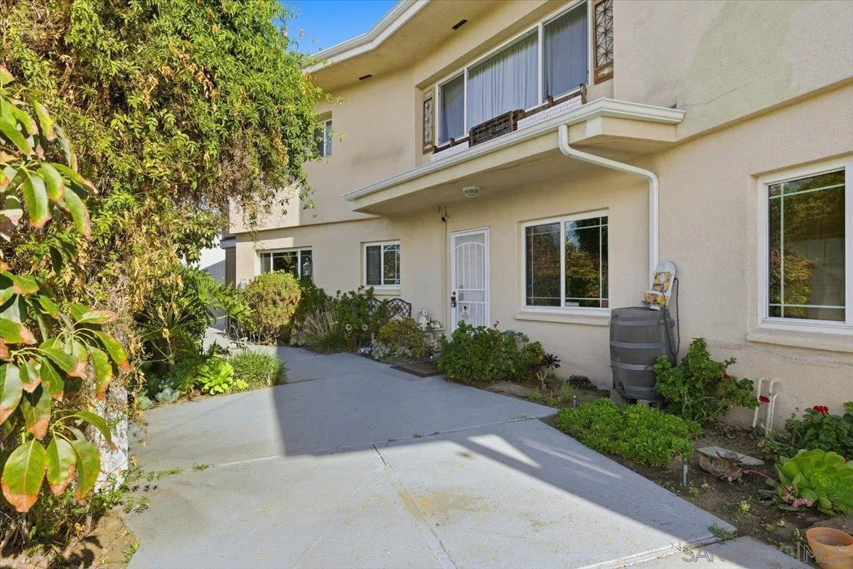 4341 Vista Way, Unit A La Mesa, CA 91941 - Photo 5 of 24 a view of a white house next to a yard