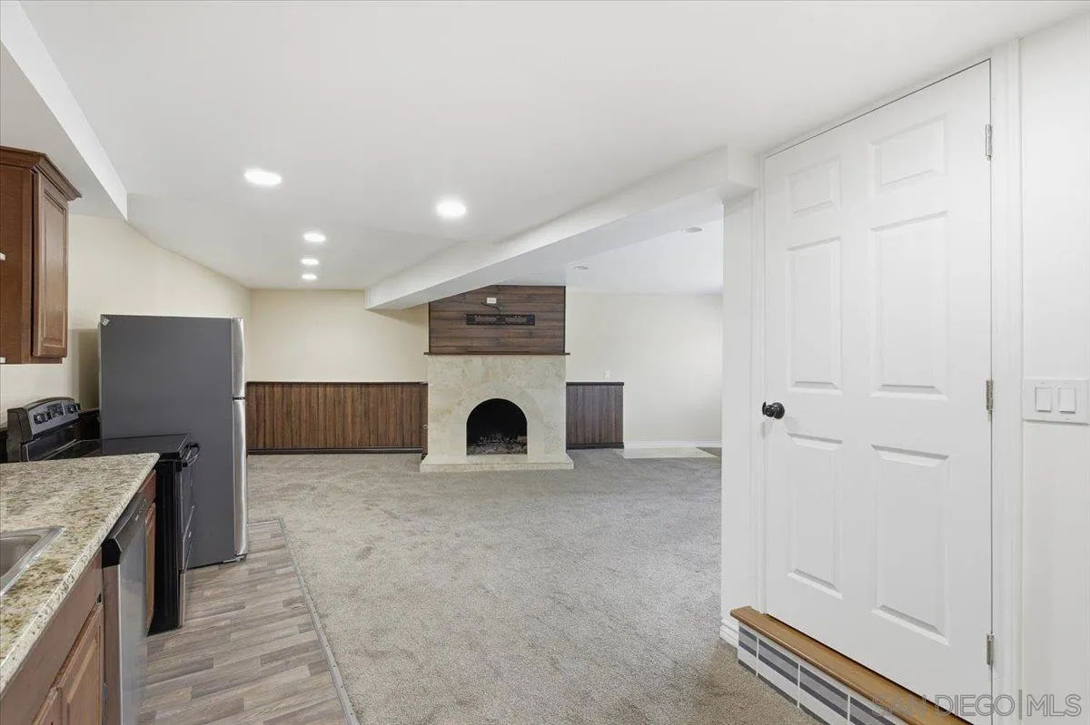 4341 Vista Way, Unit A La Mesa, CA 91941 - Photo 8 of 24 a view of a kitchen with a sink and a refrigerator