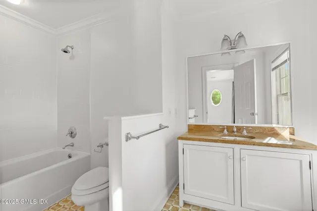 a view of an empty walk in closet with empty racks