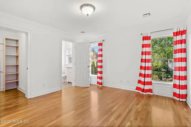 a view of an empty room with a fireplace