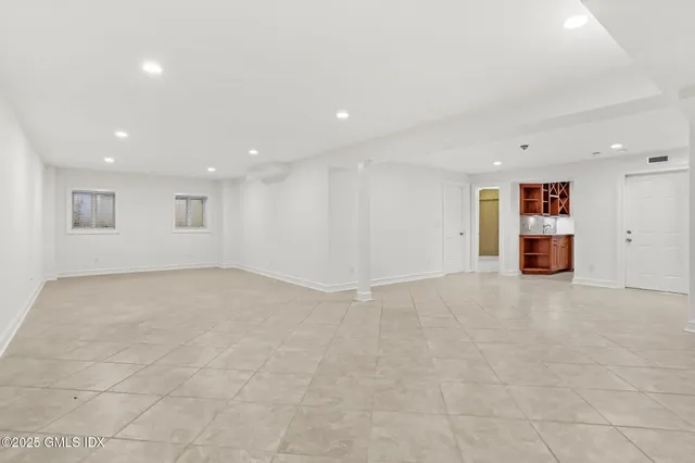 a view of a backyard with sitting area