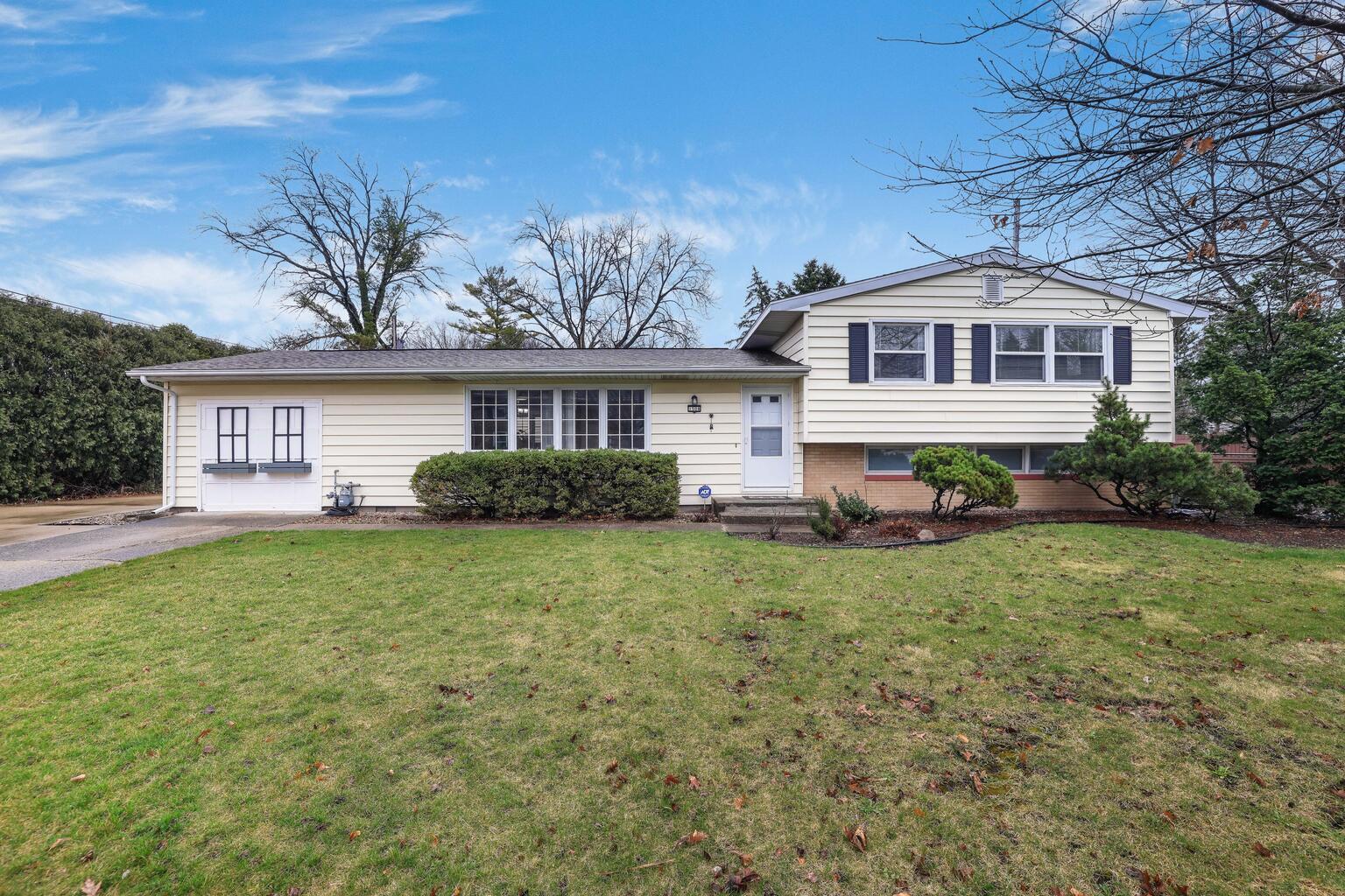 1508 Mayfair Road Champaign, IL 61821 - Photo 1 of 41 a front view of a house with a garden