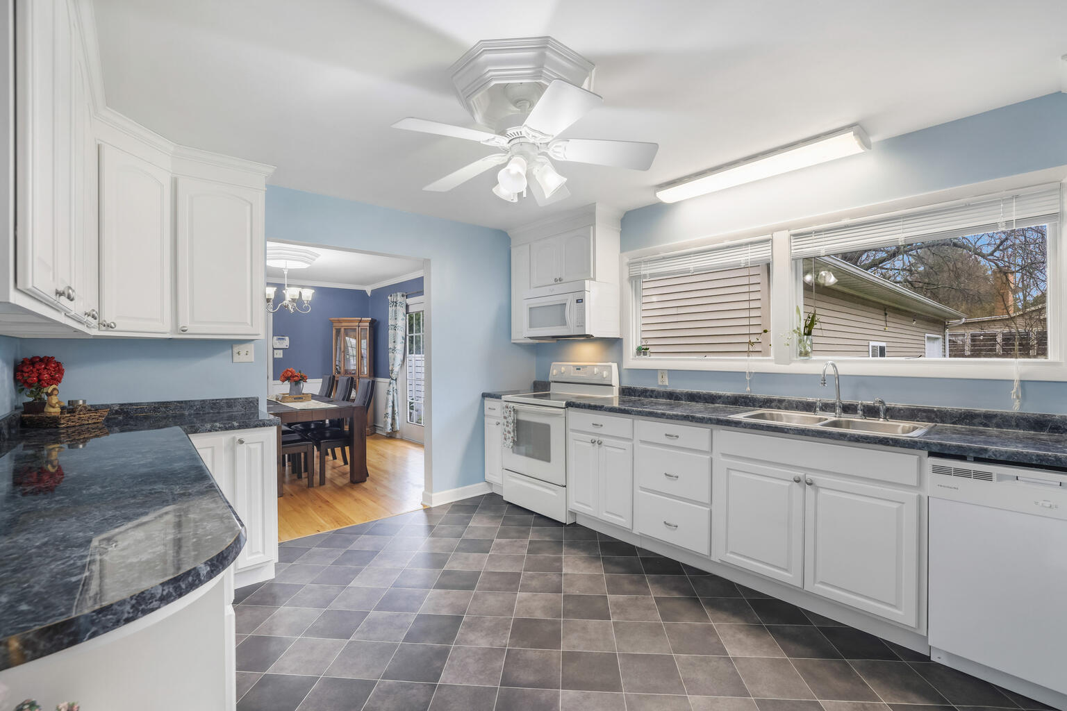 1508 Mayfair Road Champaign, IL 61821 - Photo 15 of 41 a large white kitchen with granite countertop a sink a stove and dishwasher