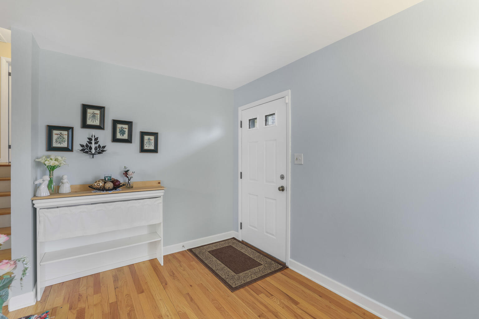 1508 Mayfair Road Champaign, IL 61821 - Photo 6 of 41 a view of a room with wooden floor and cabinet