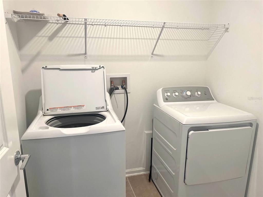 5554 Braken Fern Way Leesburg, FL 34748 - Photo 15 of 16 a utility room with dryer and washer