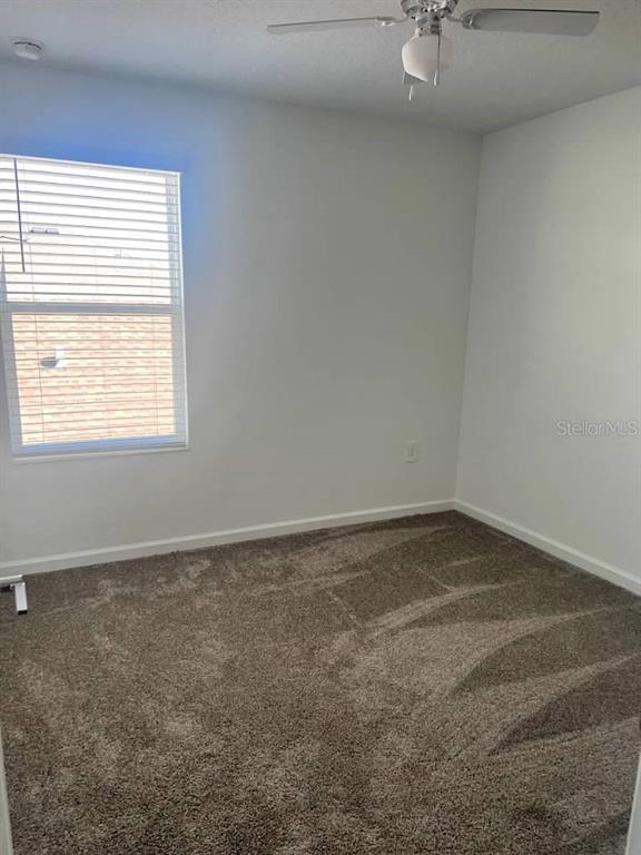 5554 Braken Fern Way Leesburg, FL 34748 - Photo 16 of 16 an empty room with a window