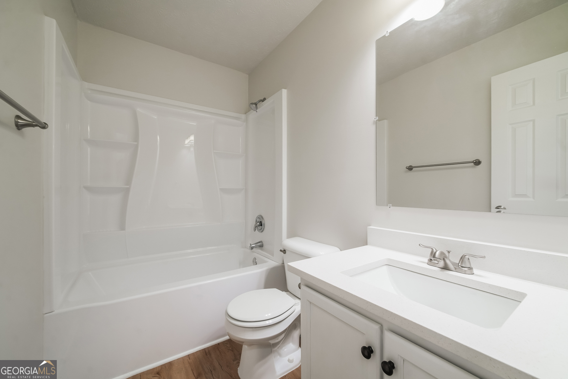 322 Yale Court Villa Rica, GA 30180 - Photo 14 of 17 a bathroom with a sink a toilet and a bathtub