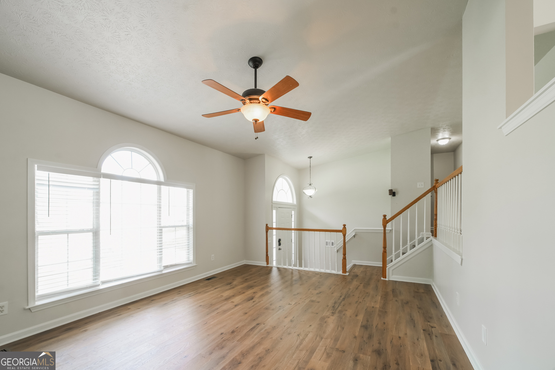 322 Yale Court Villa Rica, GA 30180 - Photo 4 of 17 wooden floor in an empty room with a window