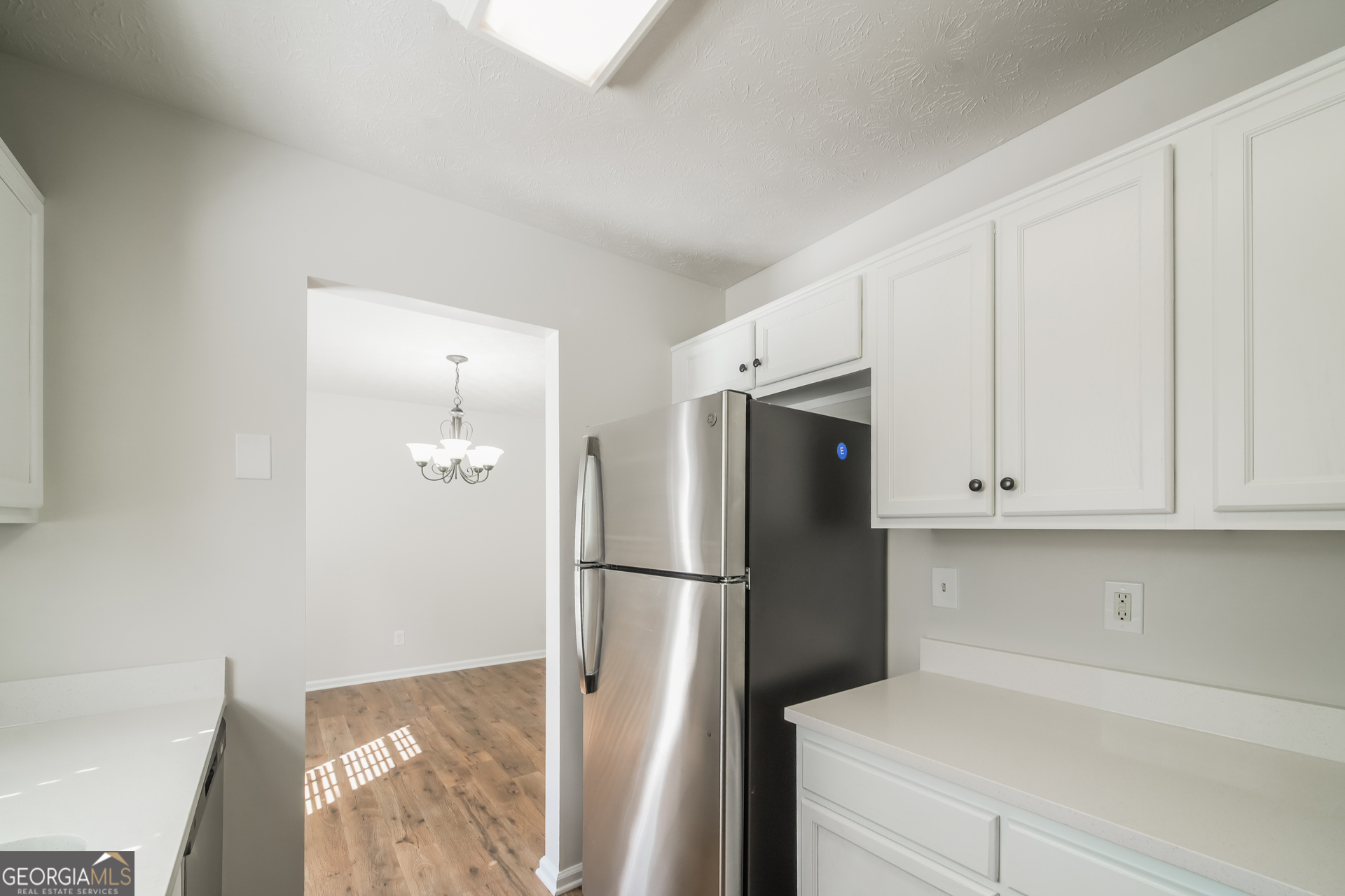 322 Yale Court Villa Rica, GA 30180 - Photo 7 of 17 a kitchen with stainless steel appliances granite countertop a refrigerator and a stove top oven