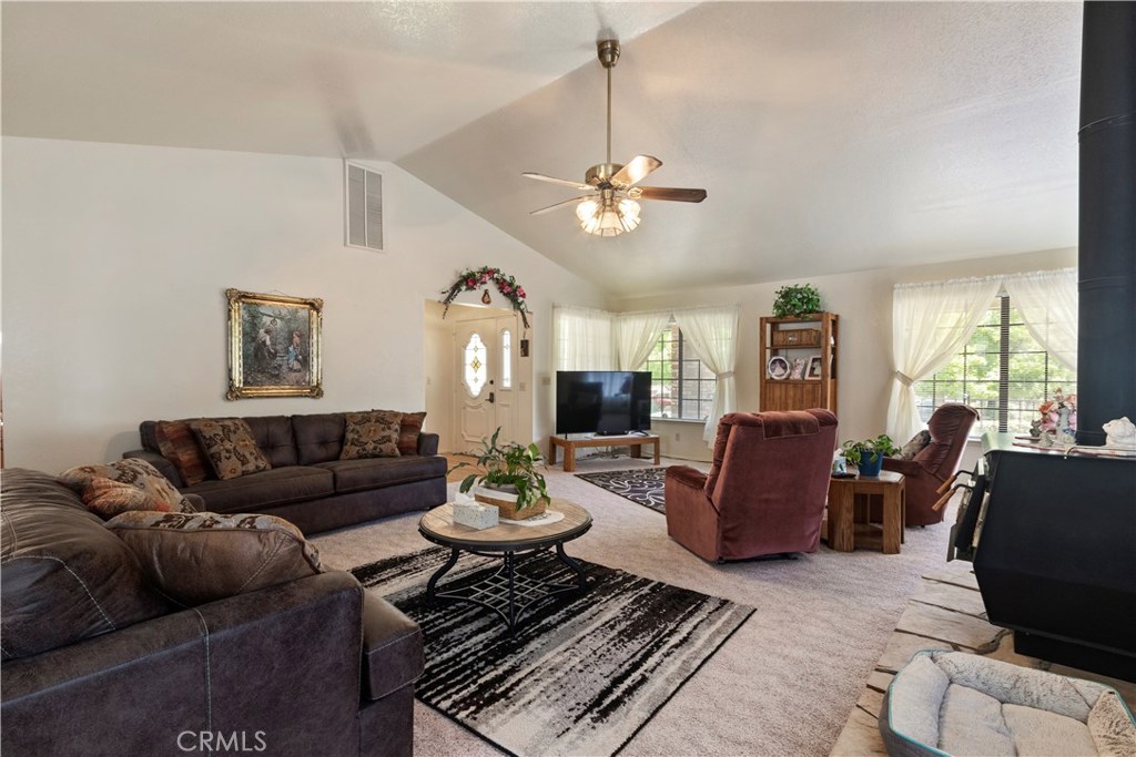 1775 Southfork Place Paso Robles, CA 93446 - Photo 13 of 36 a living room with furniture ceiling fan and a window