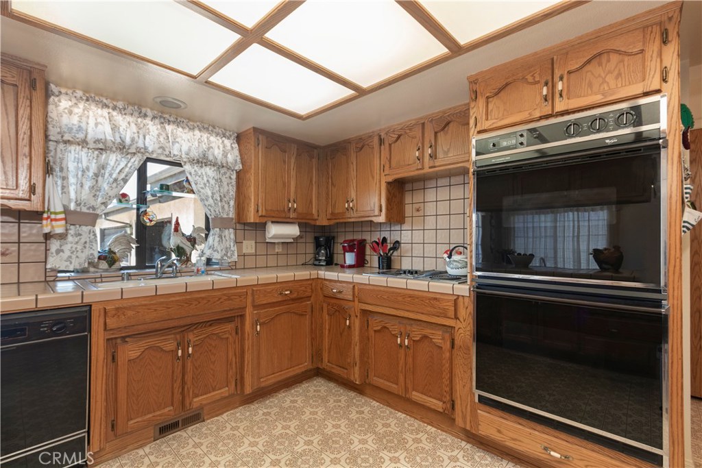 1775 Southfork Place Paso Robles, CA 93446 - Photo 18 of 36 a kitchen with sink cabinets and window