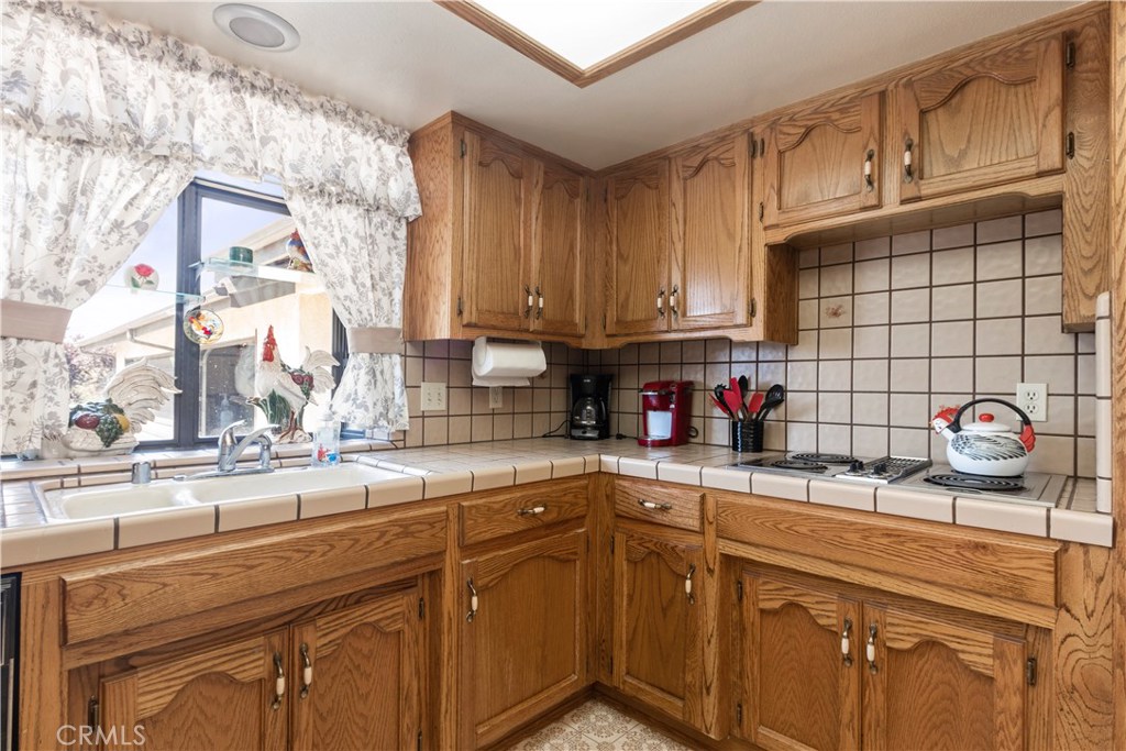 1775 Southfork Place Paso Robles, CA 93446 - Photo 19 of 36 a kitchen with a sink cabinets and window