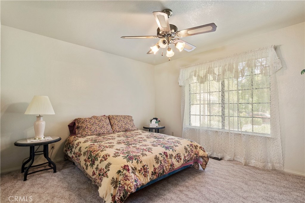 1775 Southfork Place Paso Robles, CA 93446 - Photo 22 of 36 a bedroom with a bed and a window