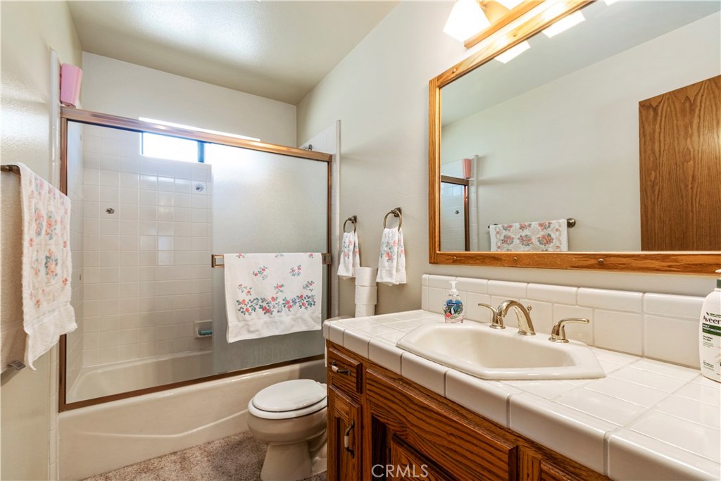 1775 Southfork Place Paso Robles, CA 93446 - Photo 24 of 36 a bathroom with a sink and a mirror