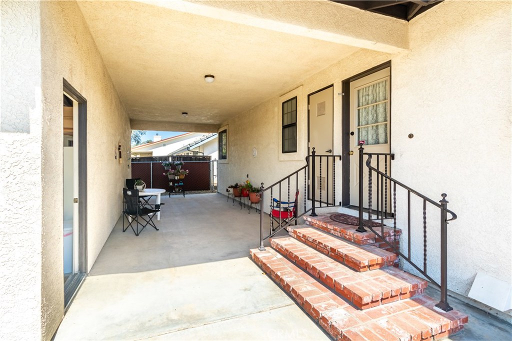 1775 Southfork Place Paso Robles, CA 93446 - Photo 27 of 36 a view of a hallway with wooden floor and furniture