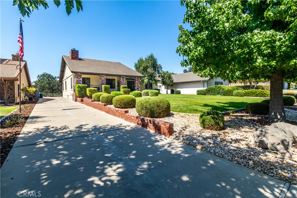 1775 Southfork Place Paso Robles, CA 93446 - Photo 3 of 36 a front view of a house with garden