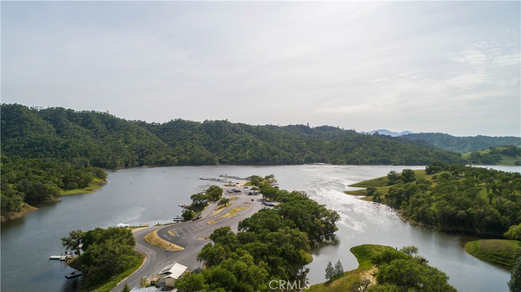 1775 Southfork Place Paso Robles, CA 93446 - Photo 33 of 36 an aerial view of green landscape with trees houses and lake view