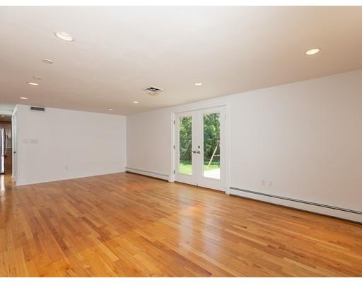 4 Barrett Road Lexington, MA 02421 - Photo 6 of 19 a view of an empty room with wooden floor and a window