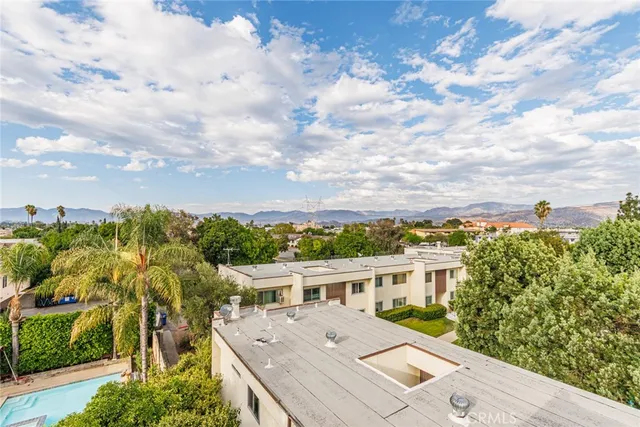 aerial view of a house with a yard
