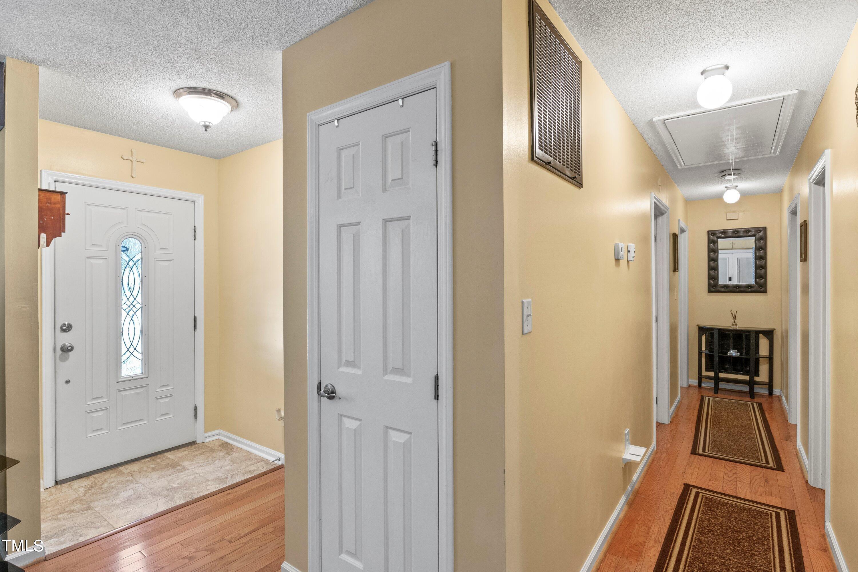 4125 Windsor Place Raleigh, NC 27609 - Photo 11 of 37 a view of a hallway with wooden floor