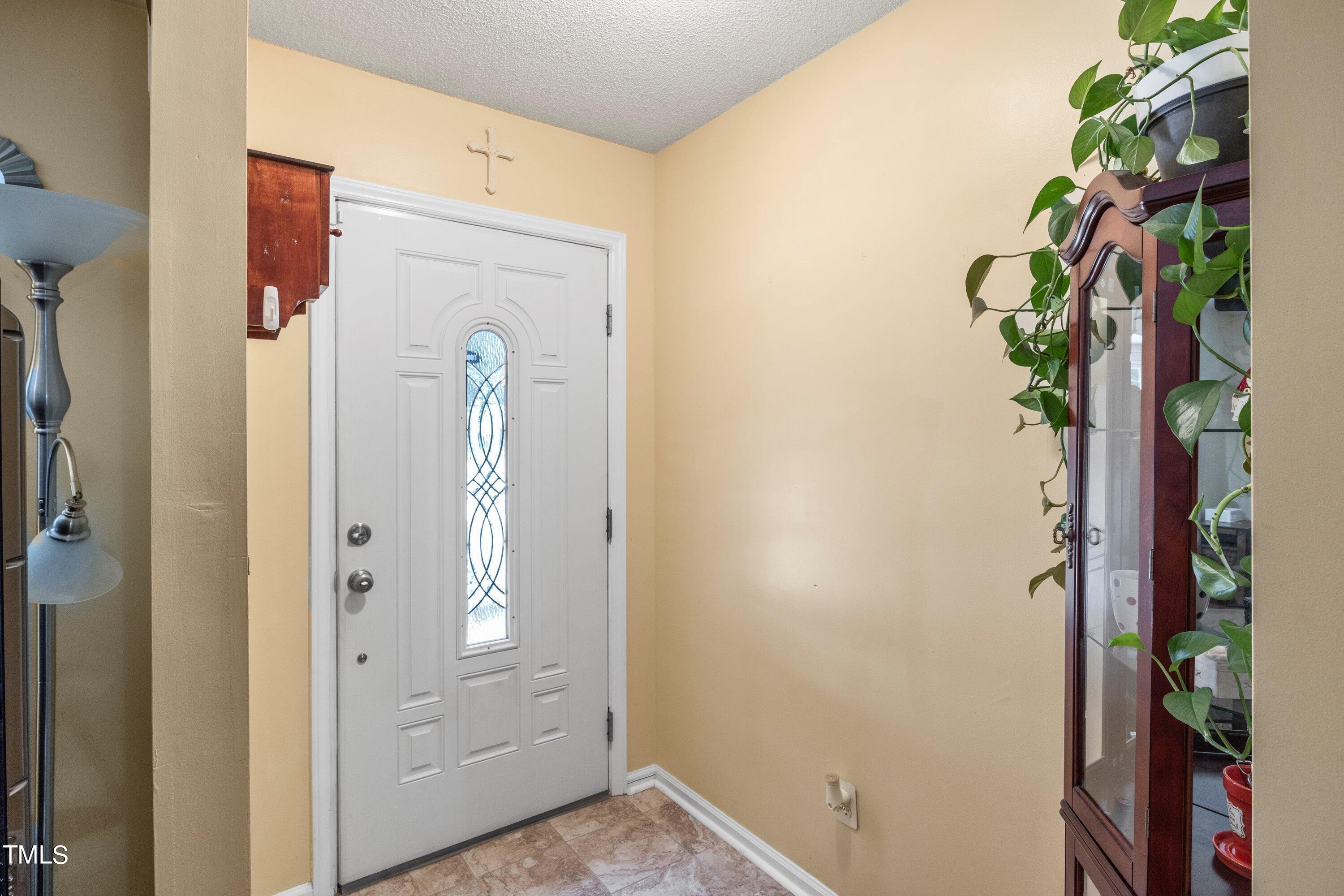 4125 Windsor Place Raleigh, NC 27609 - Photo 12 of 37 a view of a hallway with paintings on the wall