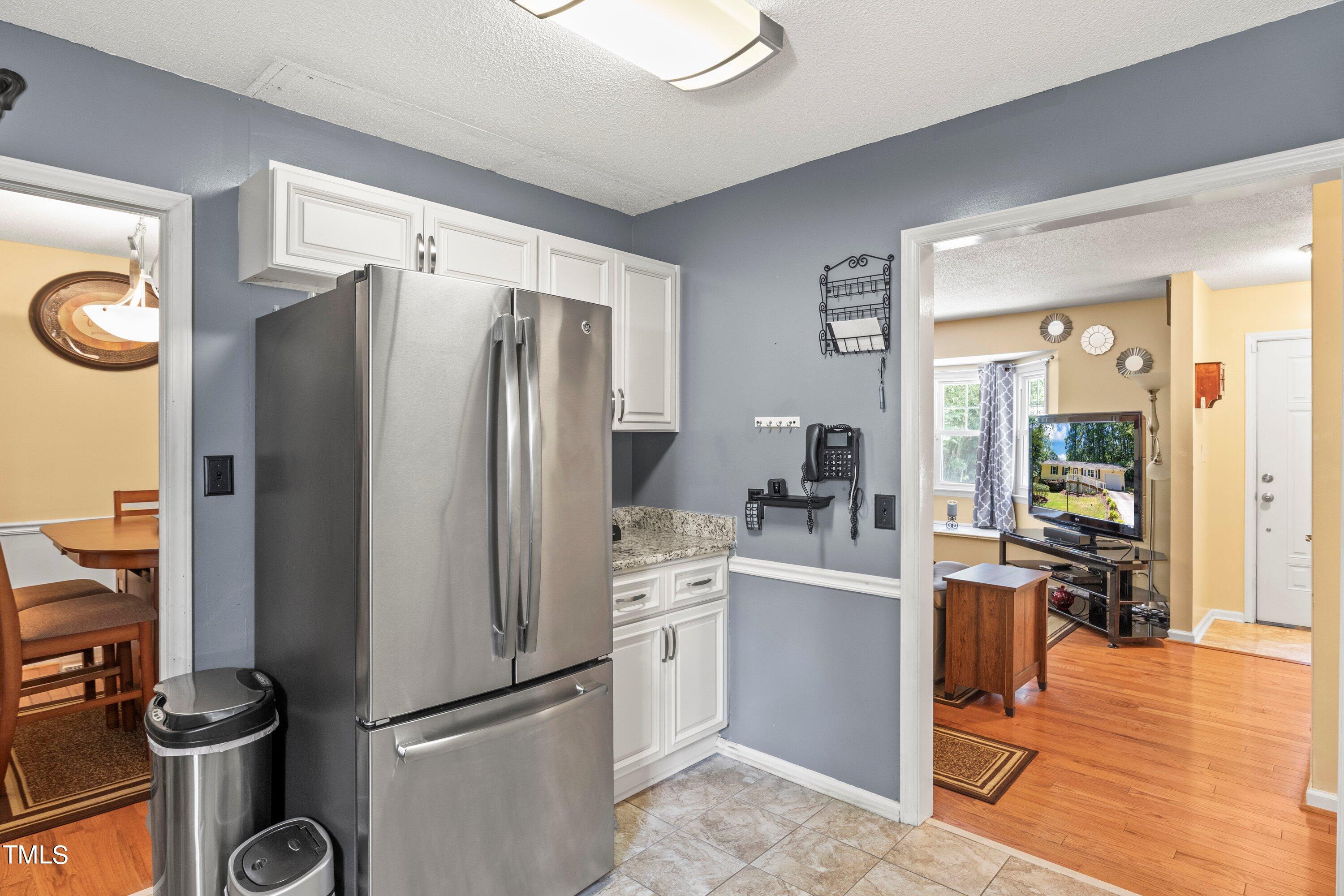 4125 Windsor Place Raleigh, NC 27609 - Photo 20 of 37 a kitchen with stainless steel appliances a refrigerator stove and sink