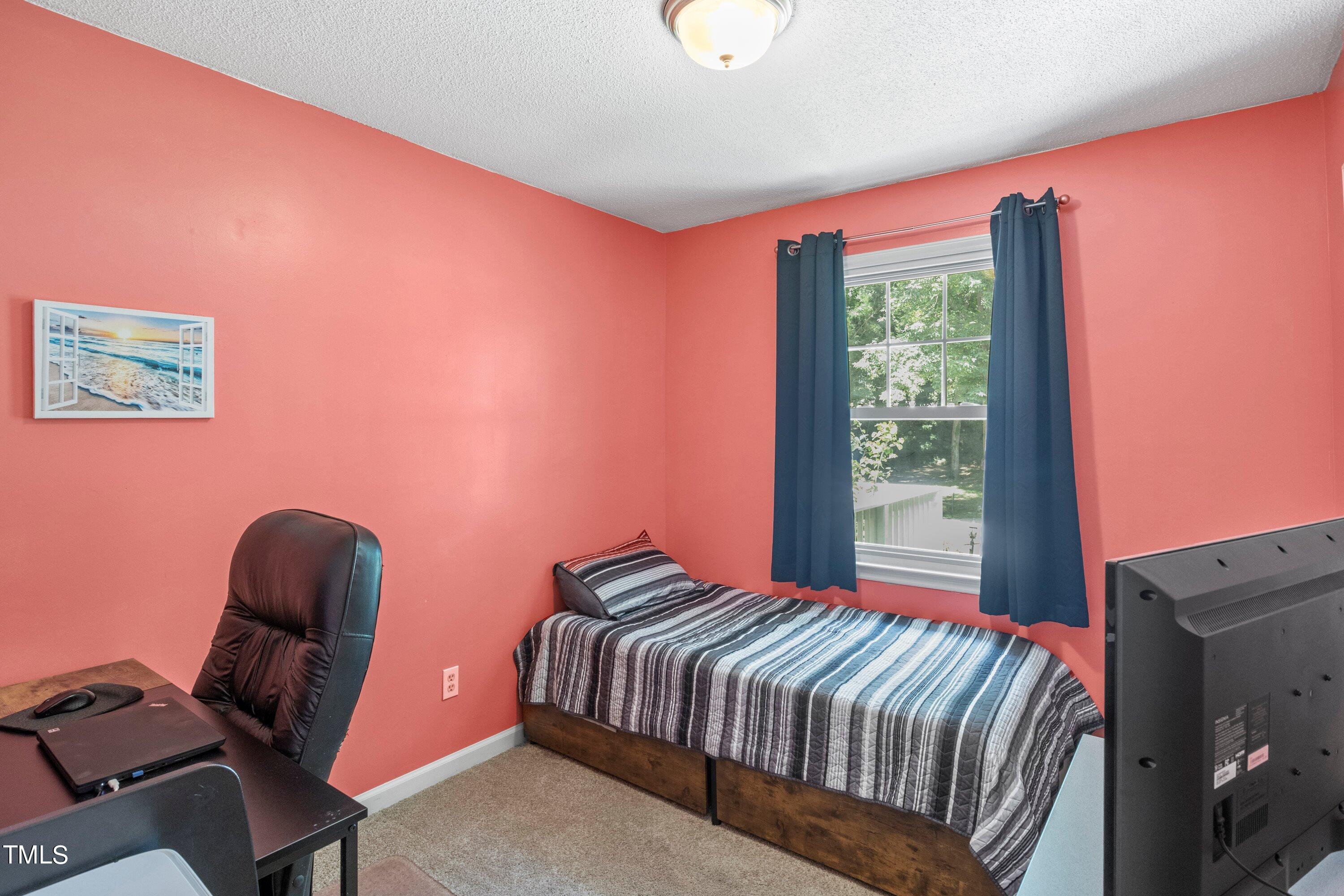 4125 Windsor Place Raleigh, NC 27609 - Photo 24 of 37 a bedroom with a bed and a window