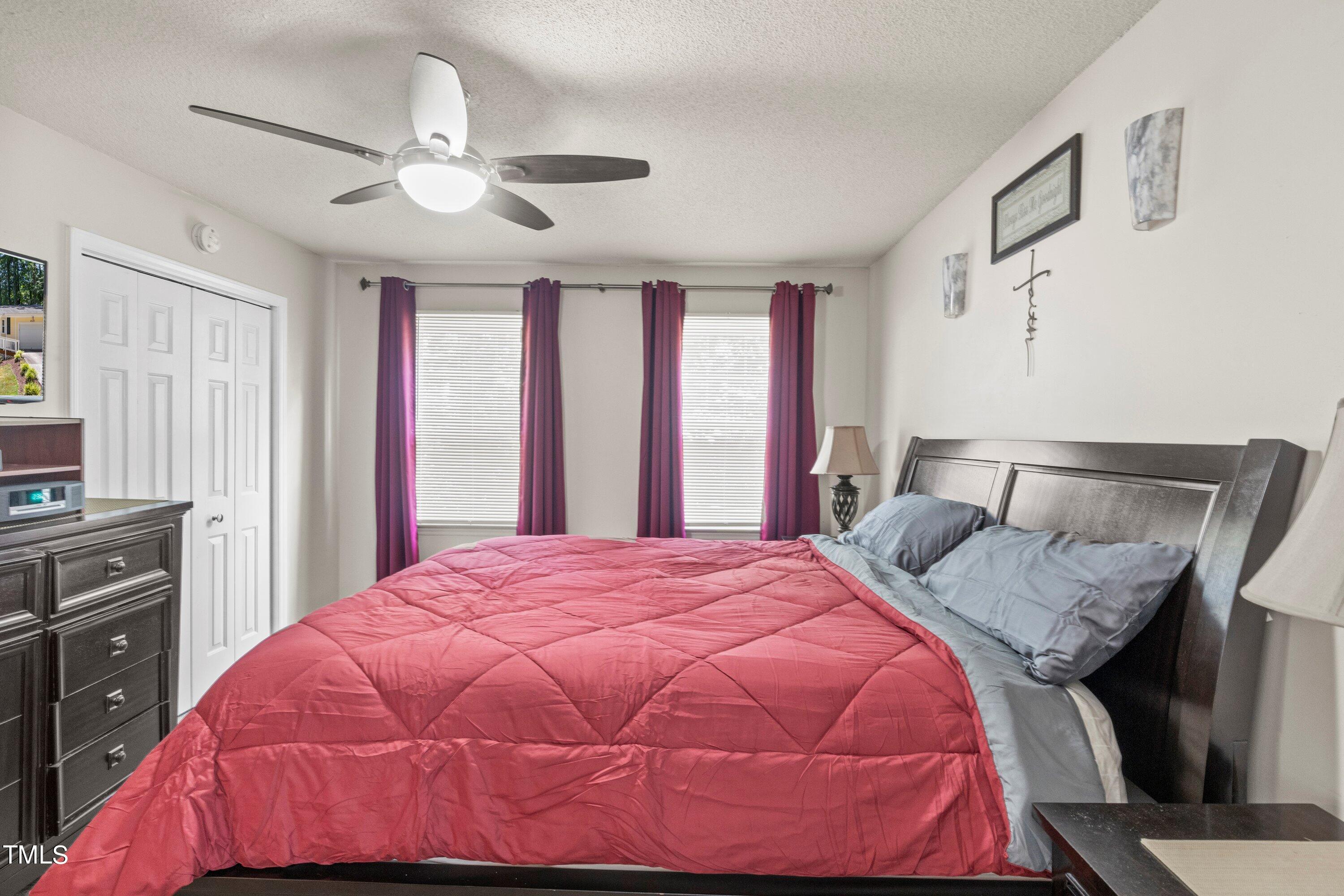 4125 Windsor Place Raleigh, NC 27609 - Photo 29 of 37 a bedroom with a bed and a dresser