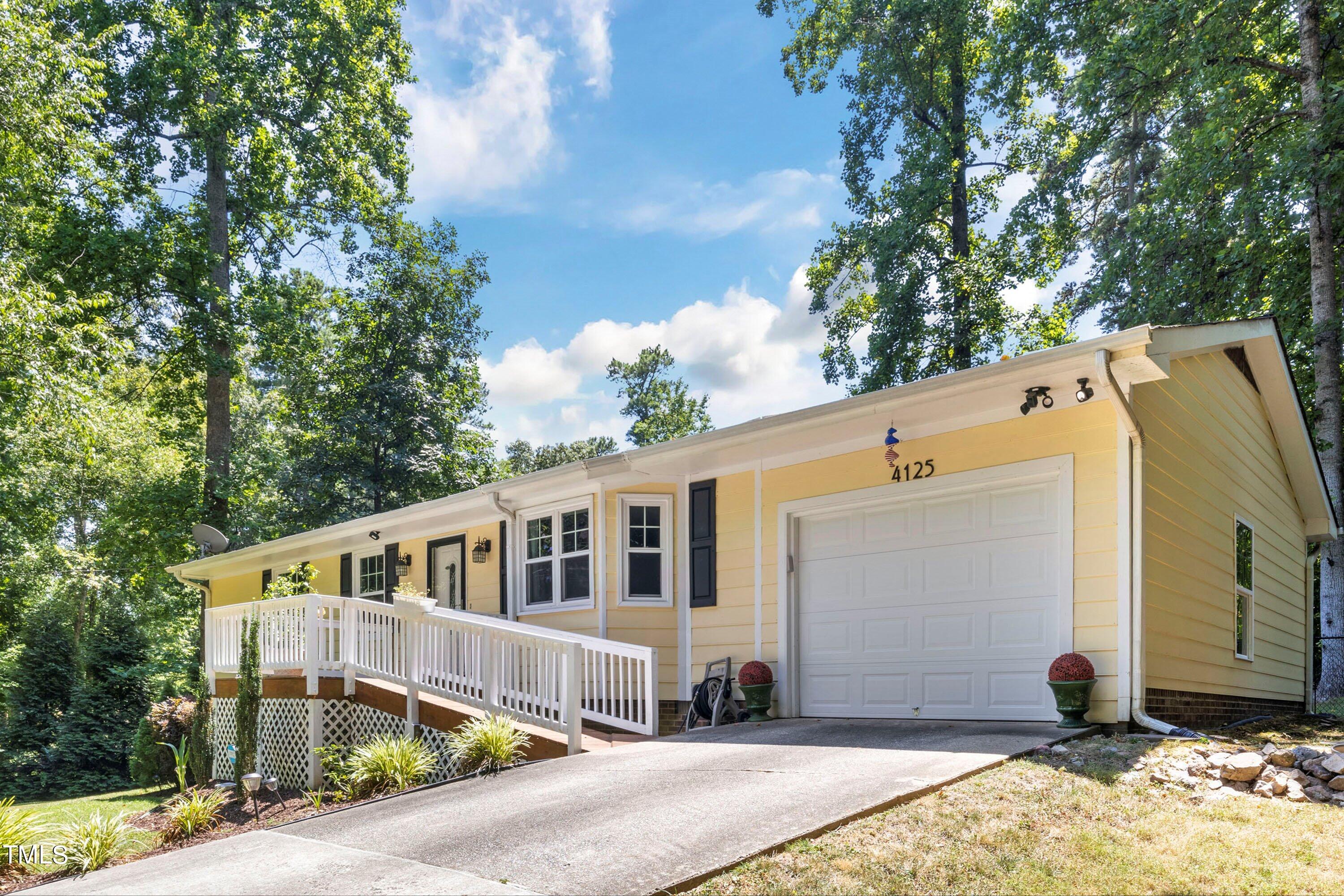 4125 Windsor Place Raleigh, NC 27609 - Photo 8 of 37 a front view of a house with a yard