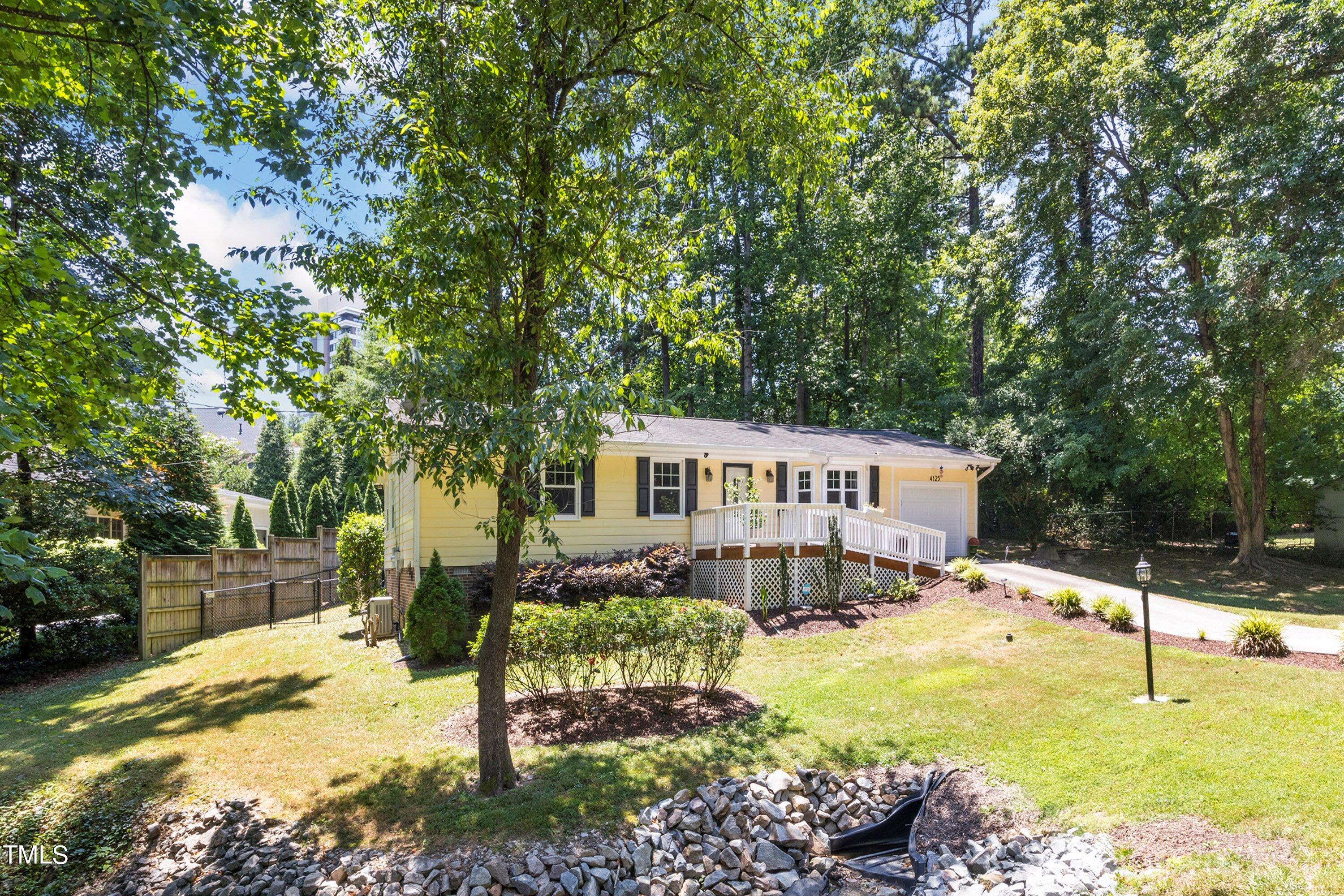 4125 Windsor Place Raleigh, NC 27609 - Photo 9 of 37 a house with trees in front of it