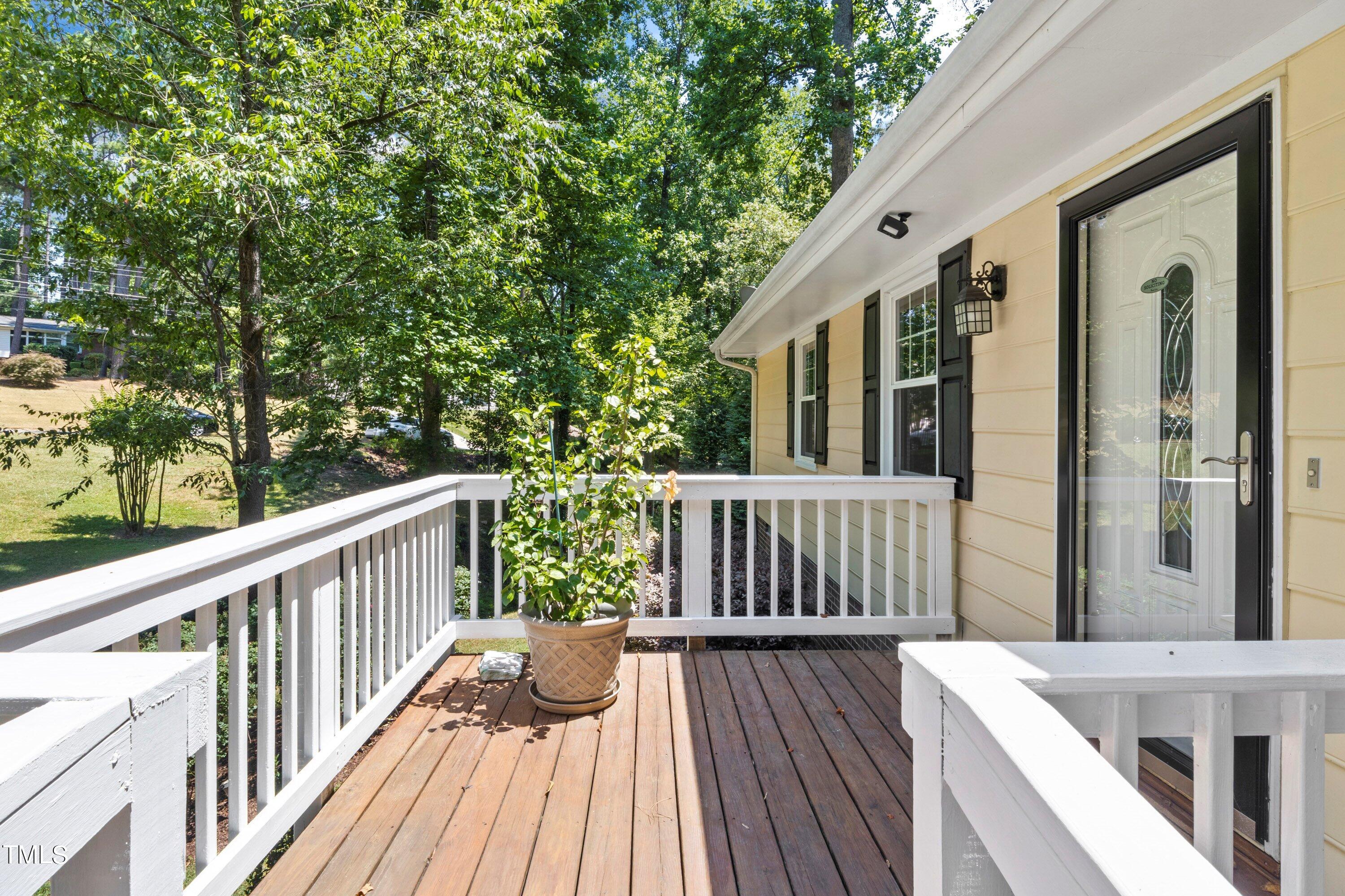 4125 Windsor Place Raleigh, NC 27609 - Photo 10 of 37 a view of balcony with wooden floor and fence