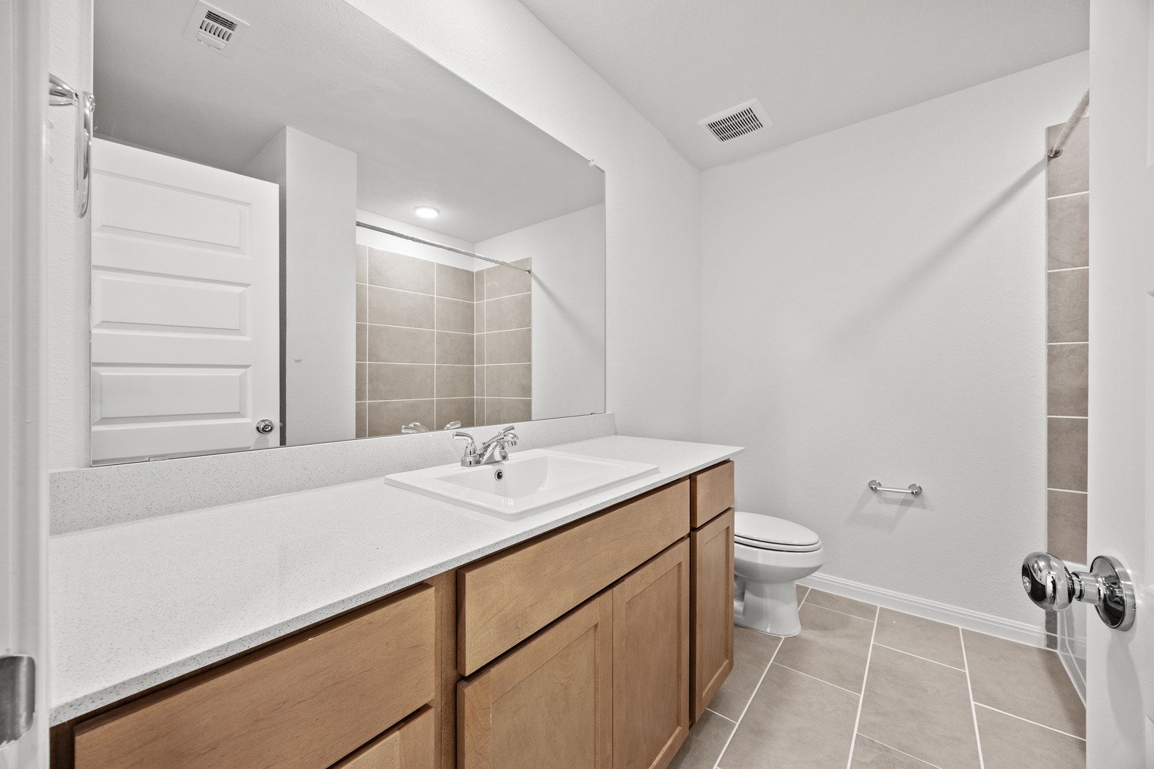 200 Hornet Street Elgin, TX 78621 - Photo 26 of 39 a bathroom with a sink a toilet and shower